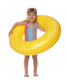 Photo of Cute little girl in swimsuit with inflatable ring on white background