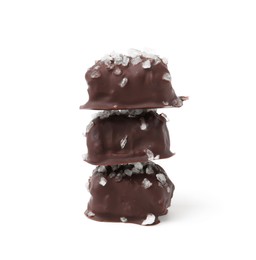 Photo of Stack of tasty chocolate candies with salt isolated on white