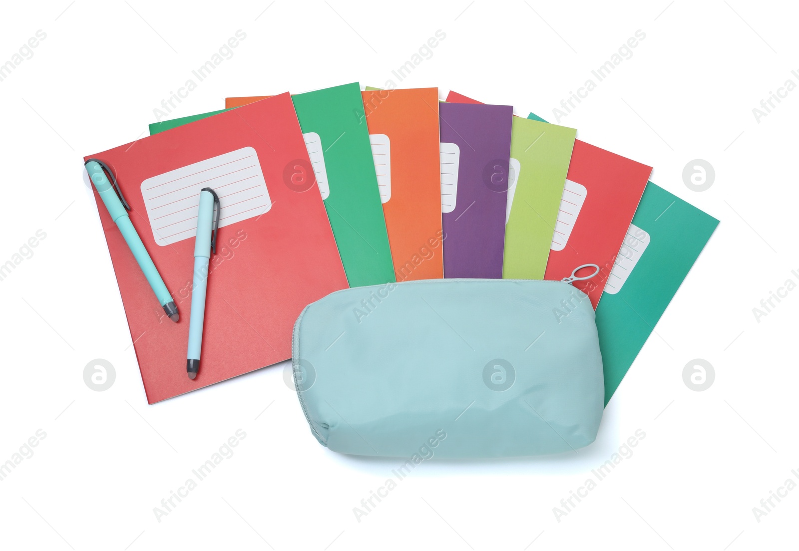 Photo of Colorful copybooks, pencil case and pens isolated on white, top view. School stationery