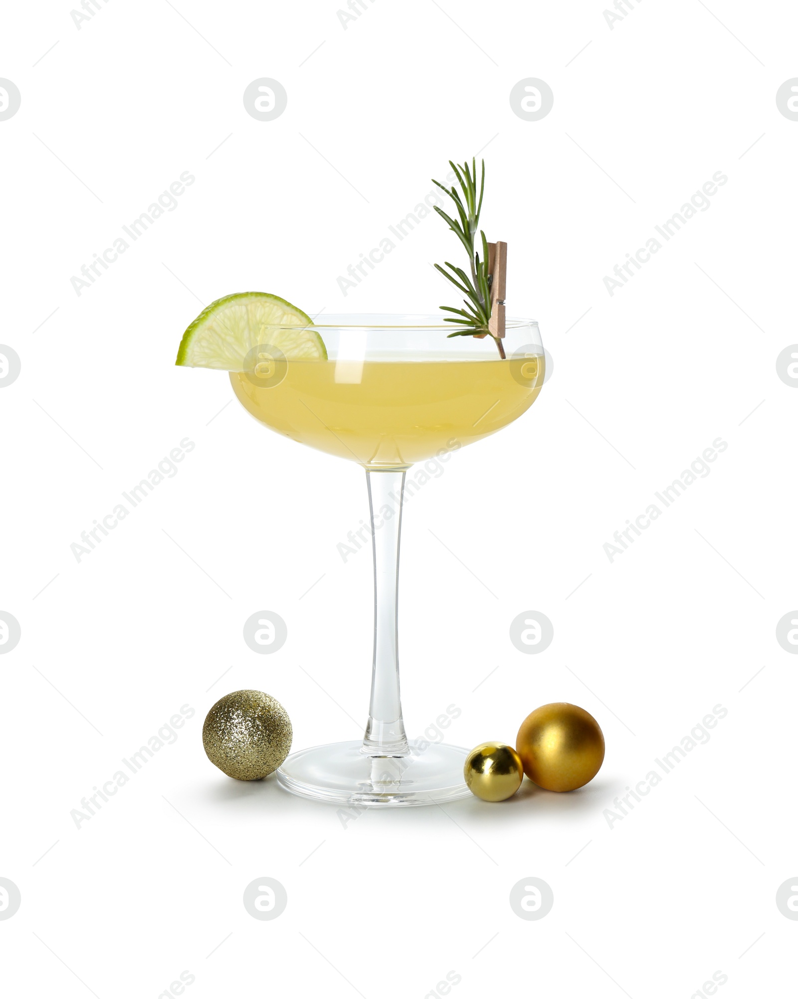 Photo of Tasty Christmas cocktail in glass and baubles isolated on white