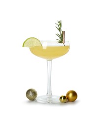 Photo of Tasty Christmas cocktail in glass and baubles isolated on white