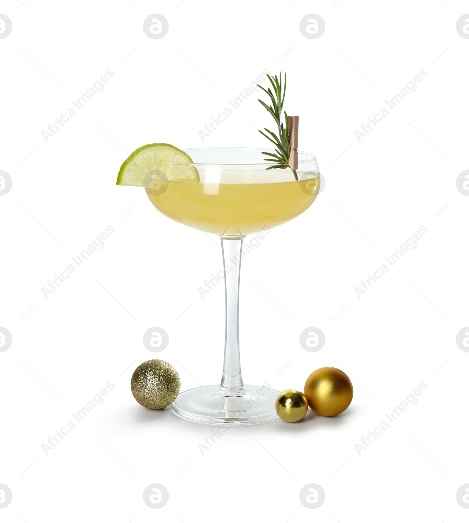 Photo of Tasty Christmas cocktail in glass and baubles isolated on white