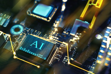 Image of Artificial intelligence. Electronic chip with AI abbreviation on computer motherboard, closeup