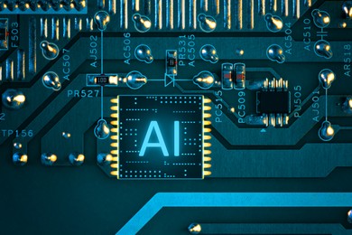 Image of Artificial intelligence. Electronic chip with AI abbreviation on circuit board, top view