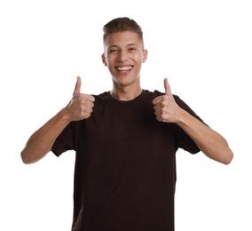 Photo of Happy man showing thumbs up on white background. Like gesture