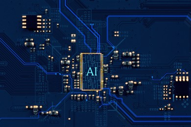 Image of Artificial intelligence. Electronic chip with AI abbreviation on circuit board, top view