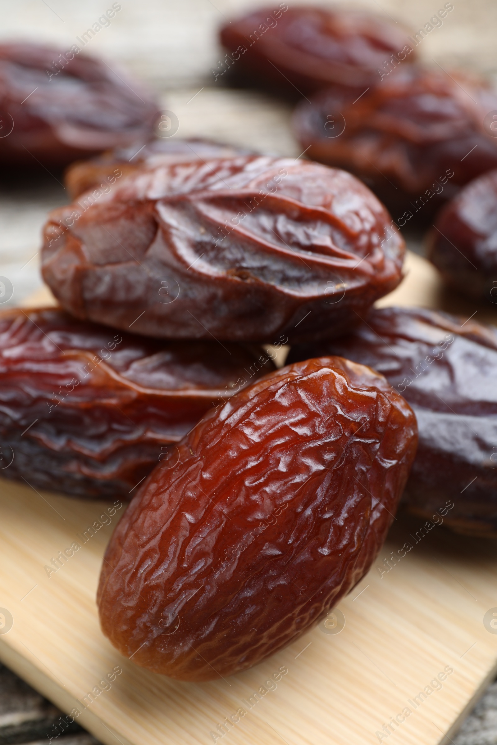 Photo of Many tasty dried dates on table, closeup