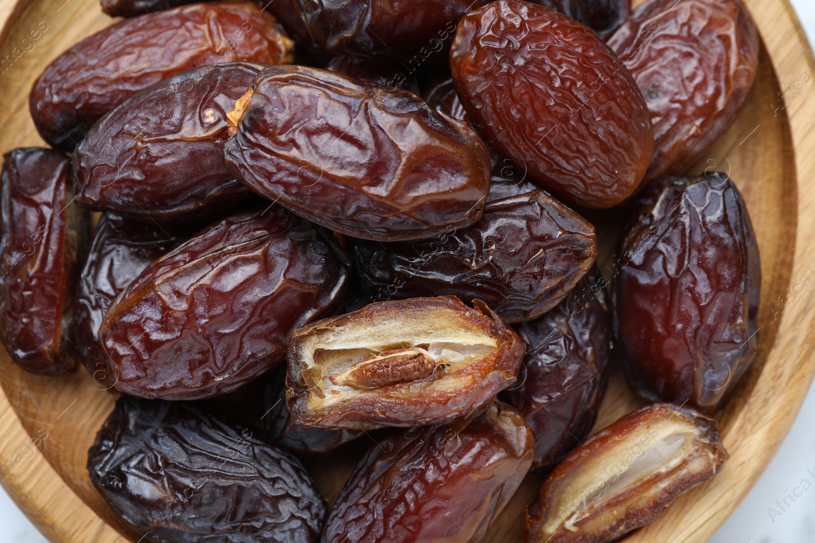 Photo of Many tasty dried dates on table, top view