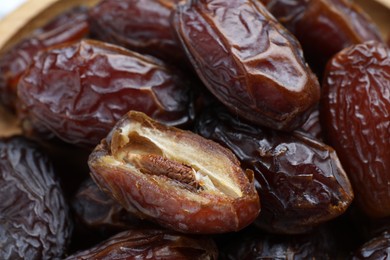 Photo of Many tasty dried dates as background, closeup