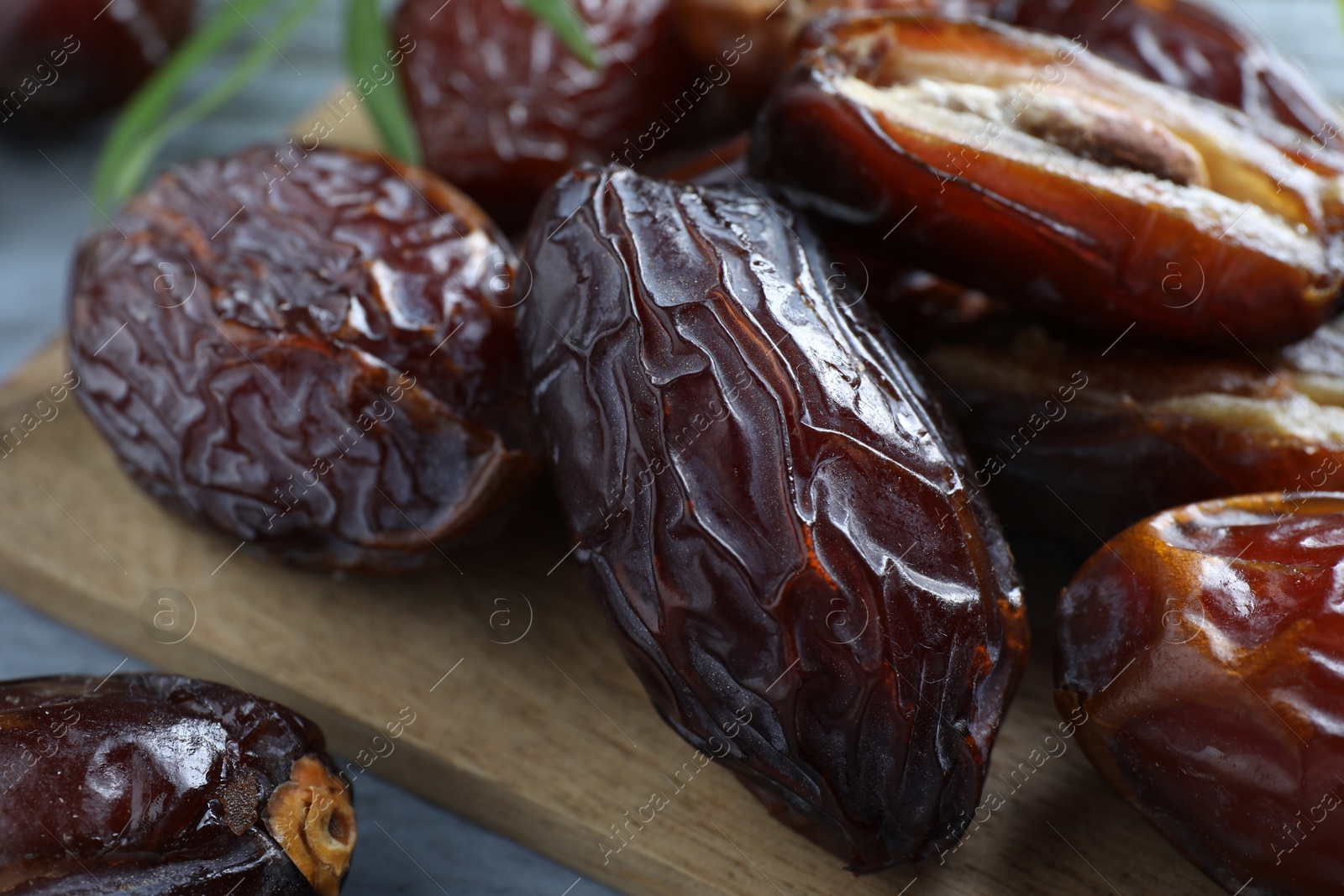 Photo of Many tasty dried dates on table, closeup