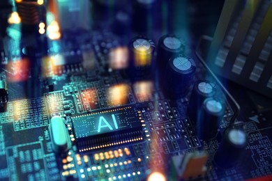 Image of Artificial intelligence. Electronic chip with AI abbreviation on computer motherboard, closeup