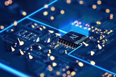 Image of Artificial intelligence. Electronic chip with AI abbreviation on computer circuit board, closeup