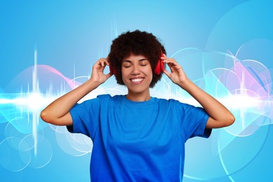 Image of Young woman with headphones listening to music on light blue background. Sound waves behind her