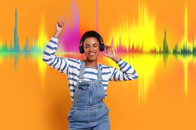 Young woman with headphones listening to music on orange background. Sound waves behind her