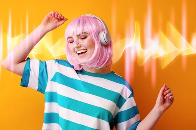 Image of Fashionable young woman in pink wig with headphones listening to music on orange background. Sound waves behind her