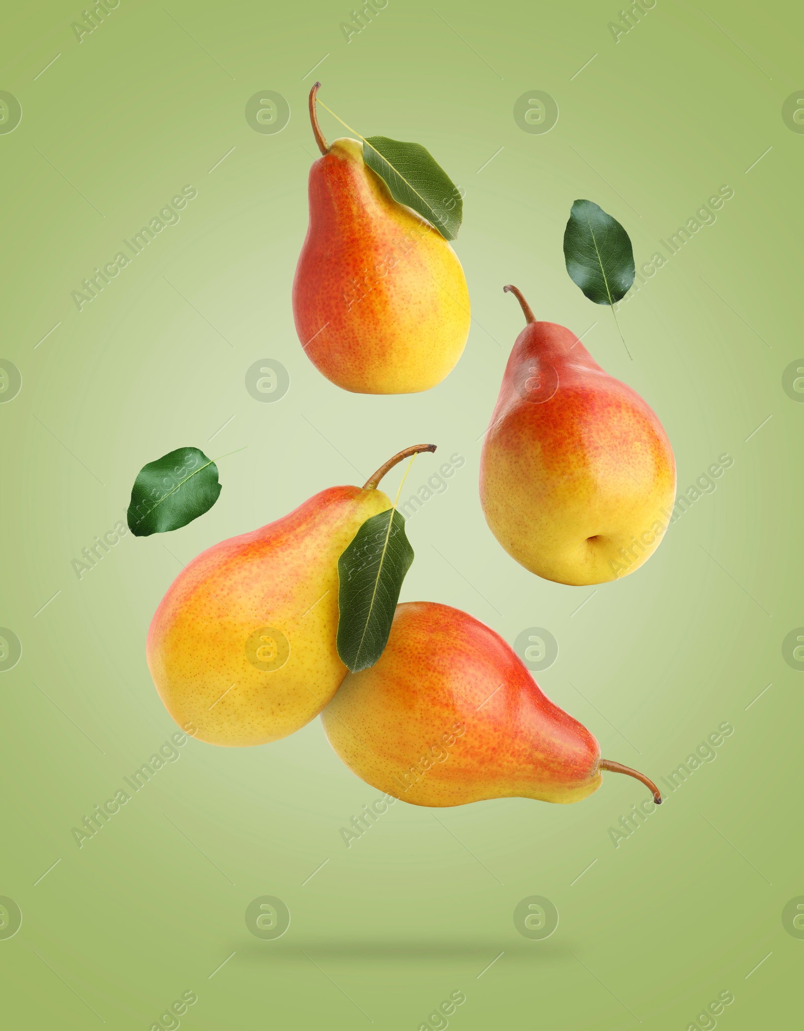 Fresh juicy pears in air on green background Image of Fresh juicy pears in air on green background