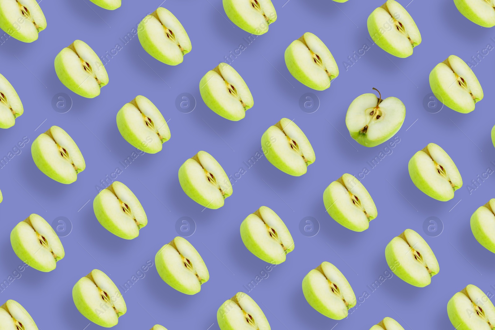 Image of Pattern of fresh apples on violet blue background. One fruit in another direction