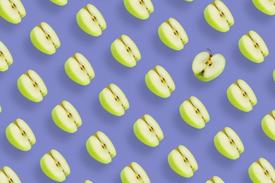 Image of Pattern of fresh apples on violet blue background. One fruit in another direction