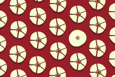 Image of Pattern of fresh apple slices on red background