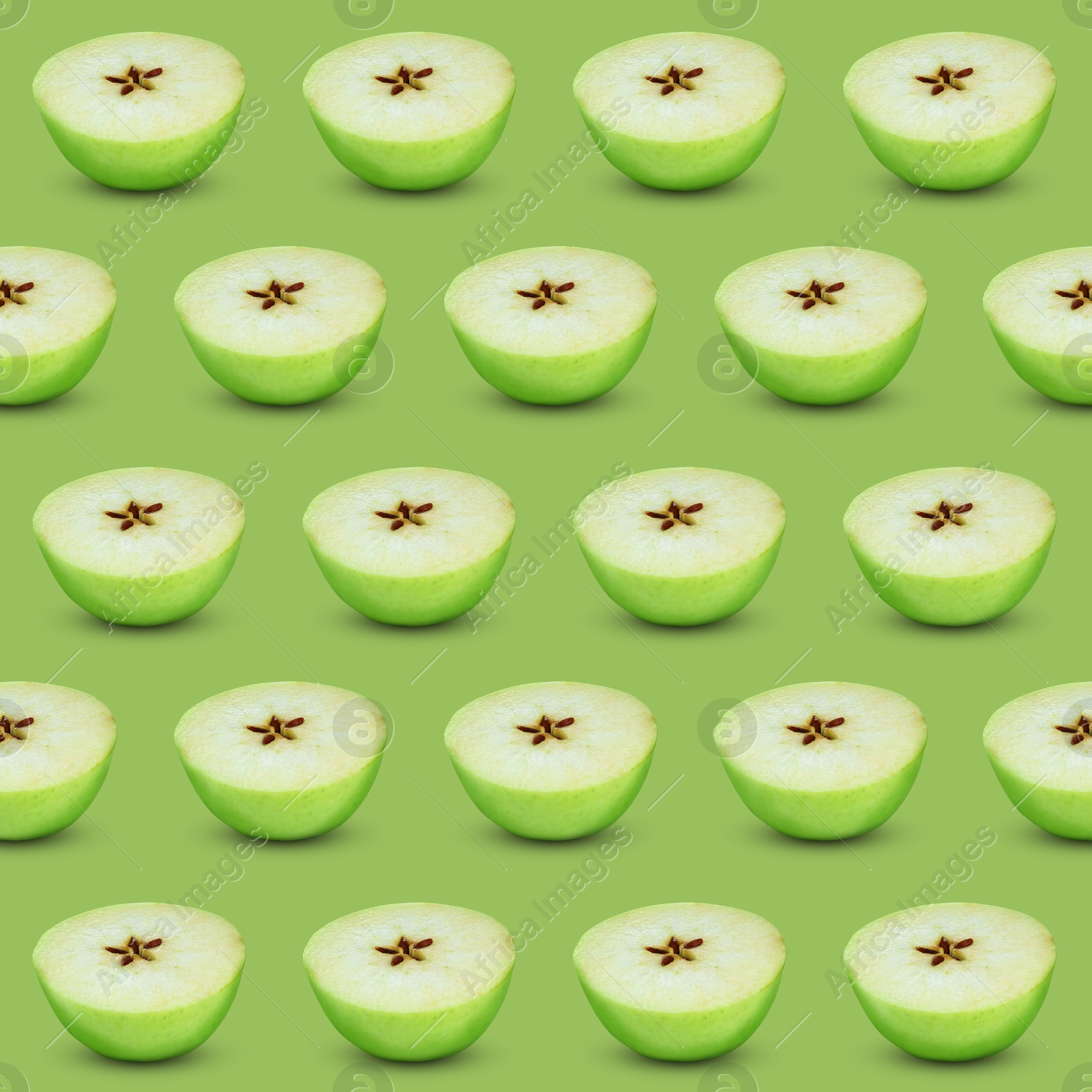 Image of Halves of fresh apple on light green background, seamless pattern