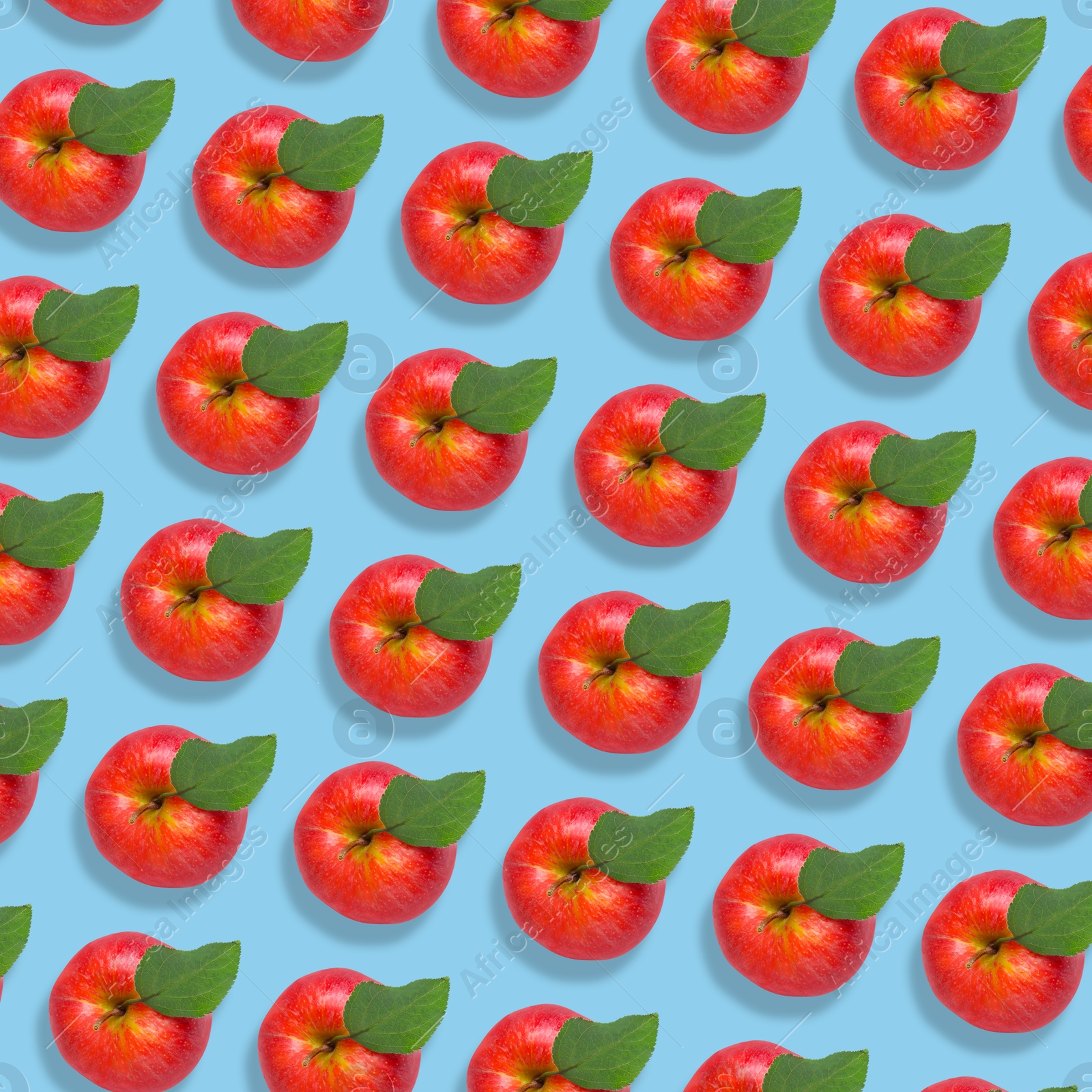 Image of Pattern of fresh red apples on light blue background