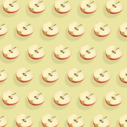 Image of Halves of fresh red apple on beige background, seamless pattern