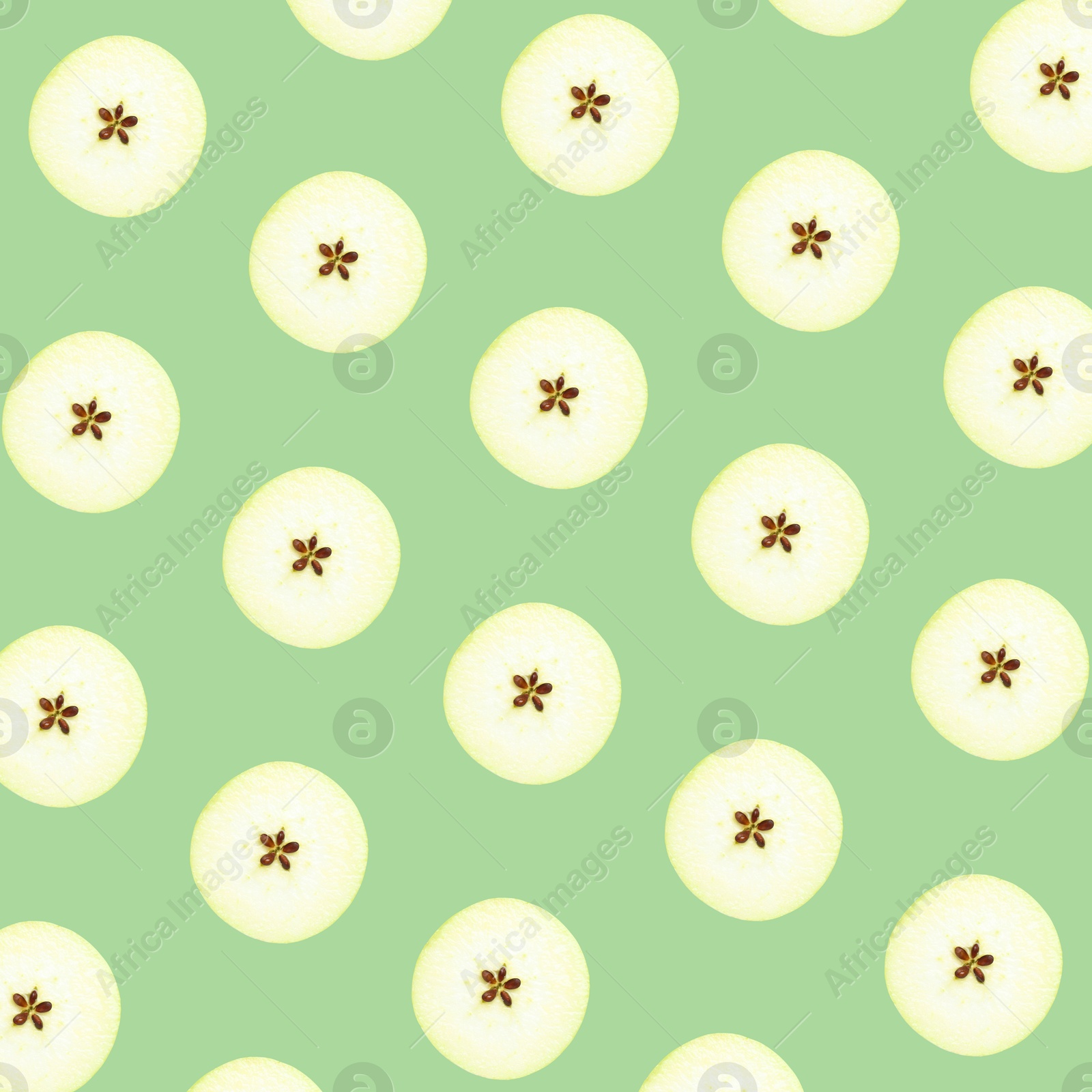 Image of Halves of fresh apple on light green background, seamless pattern