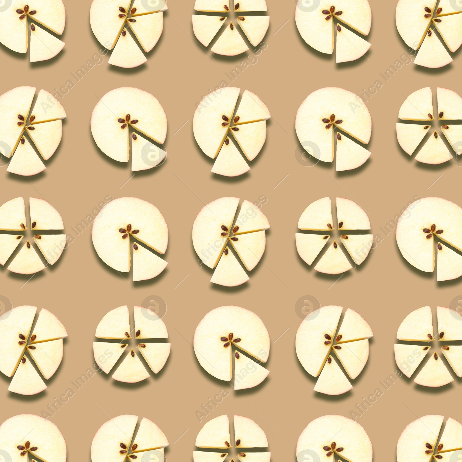 Image of Pattern of fresh apple slices on beige background