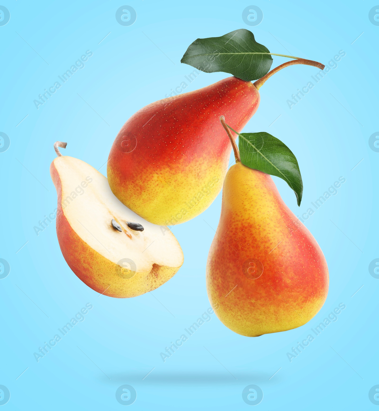 Image of Fresh juicy pears in air on light blue background