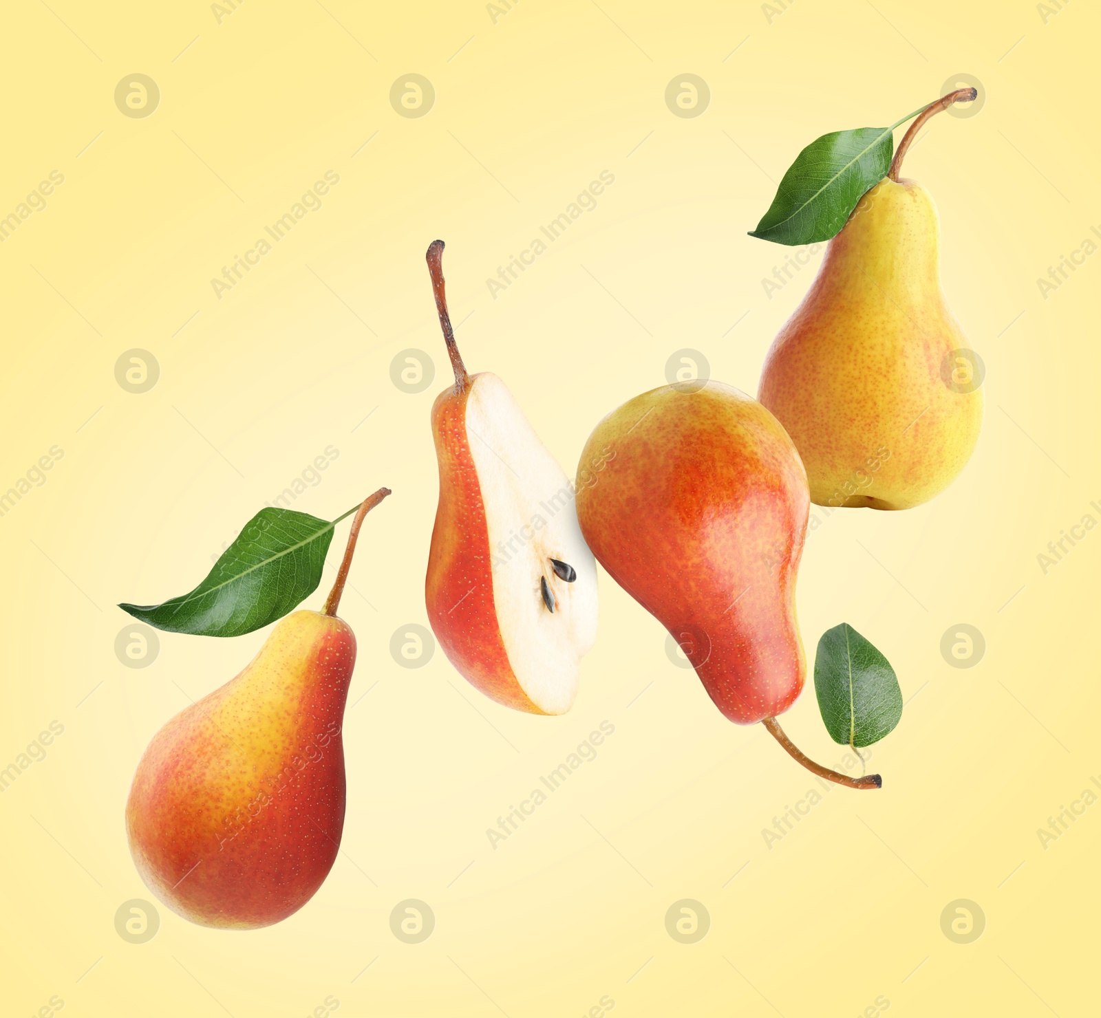 Image of Fresh juicy pears in air on yellow background