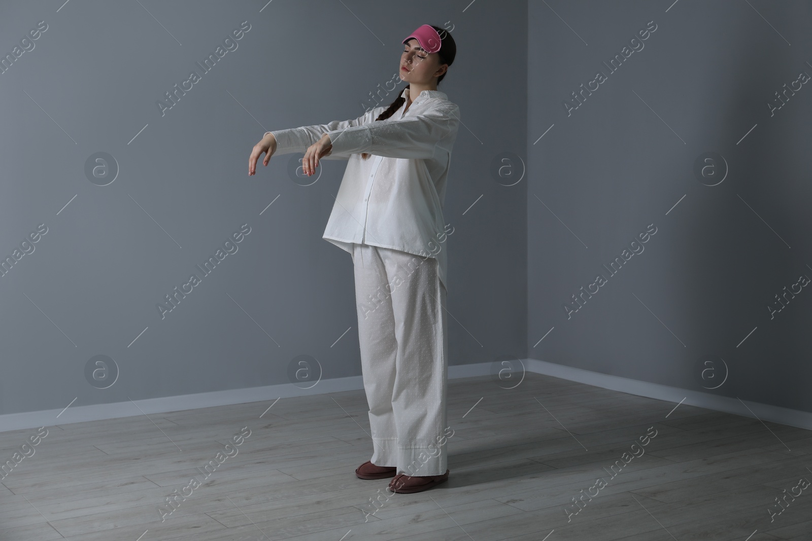 Photo of Young woman suffering from sleepwalking at home