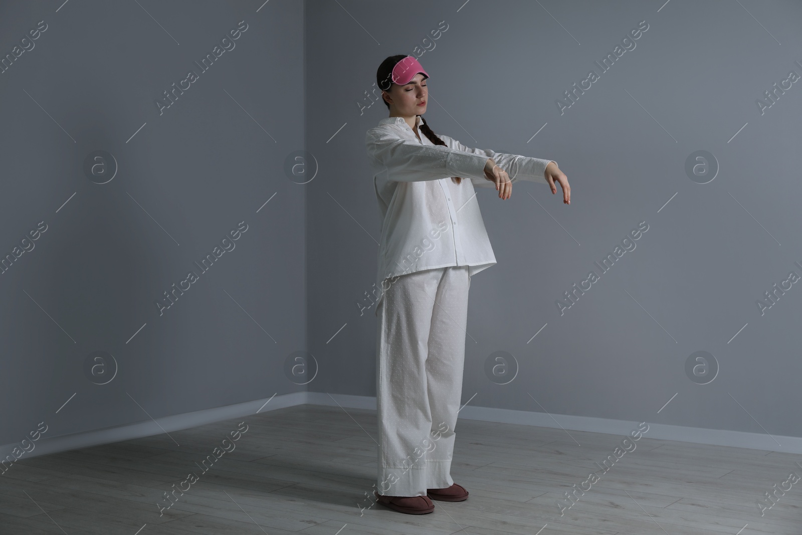 Photo of Young woman suffering from sleepwalking at home