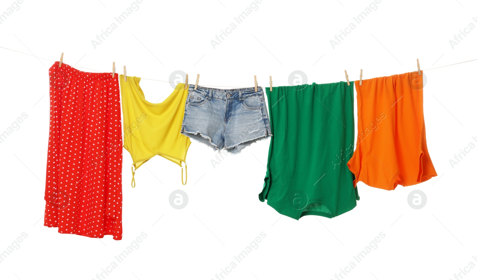 Photo of Different clothes drying on laundry line against white background