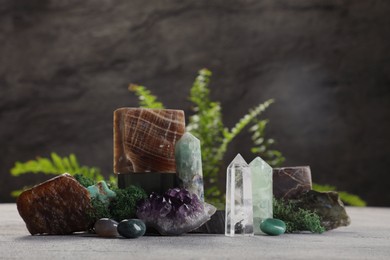 Natural gemstones and moss on light table