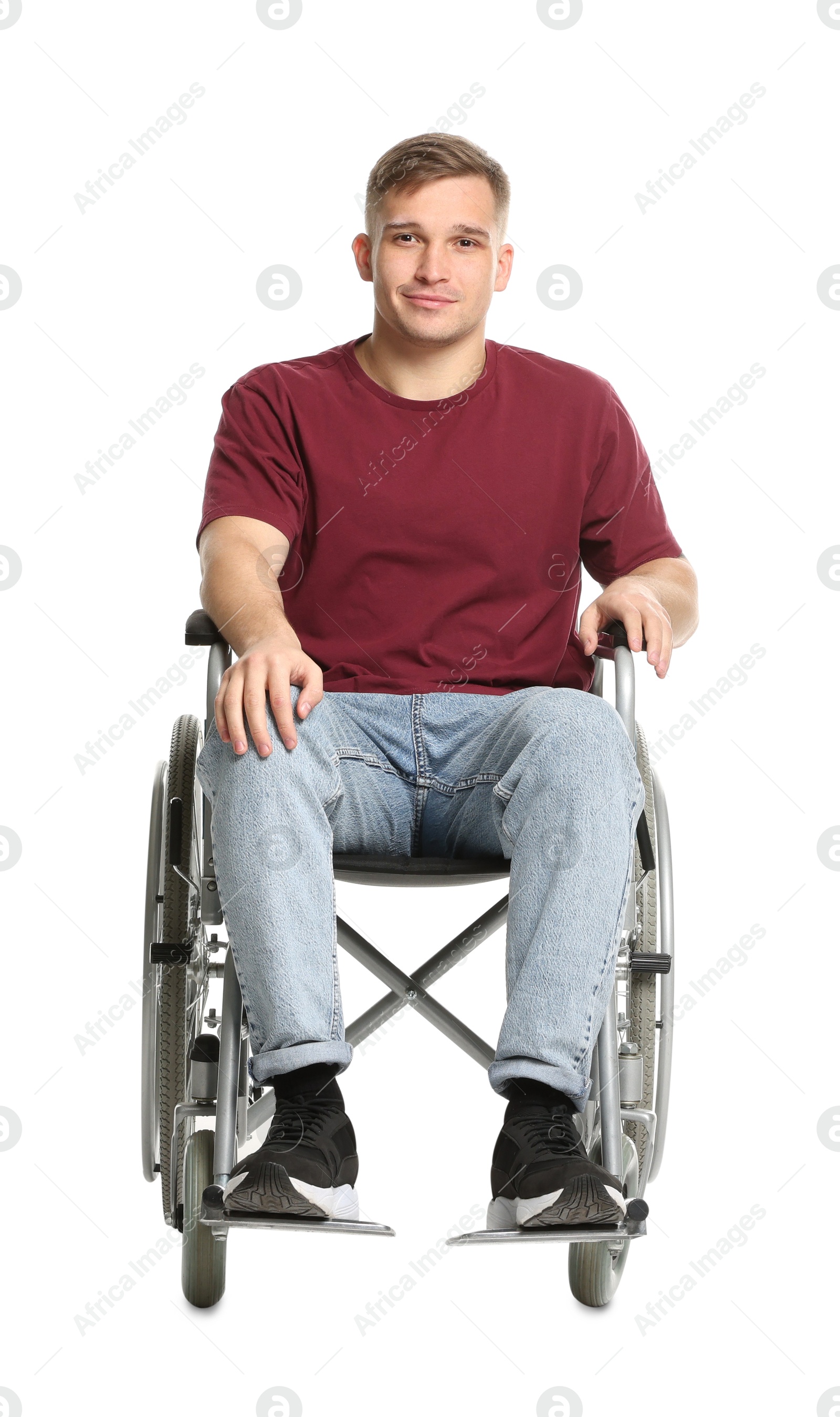 Photo of Young man in wheelchair on white background