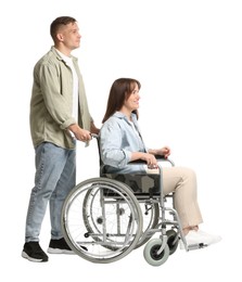 Photo of Caregiver with woman in wheelchair on white background