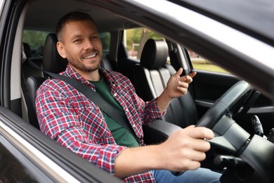 Photo of Man driving modern car, view through window