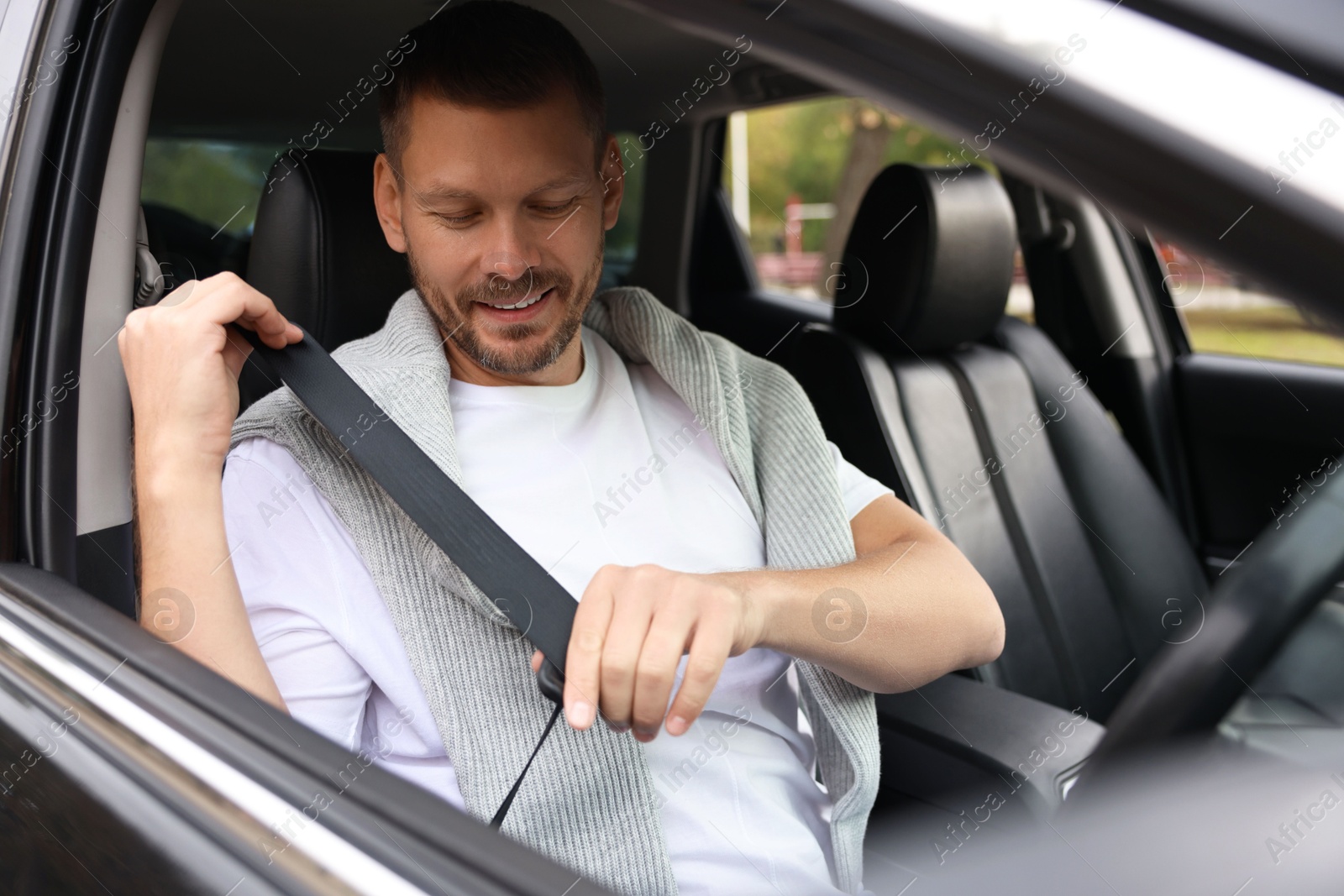 Photo of Man driving modern car, view through window