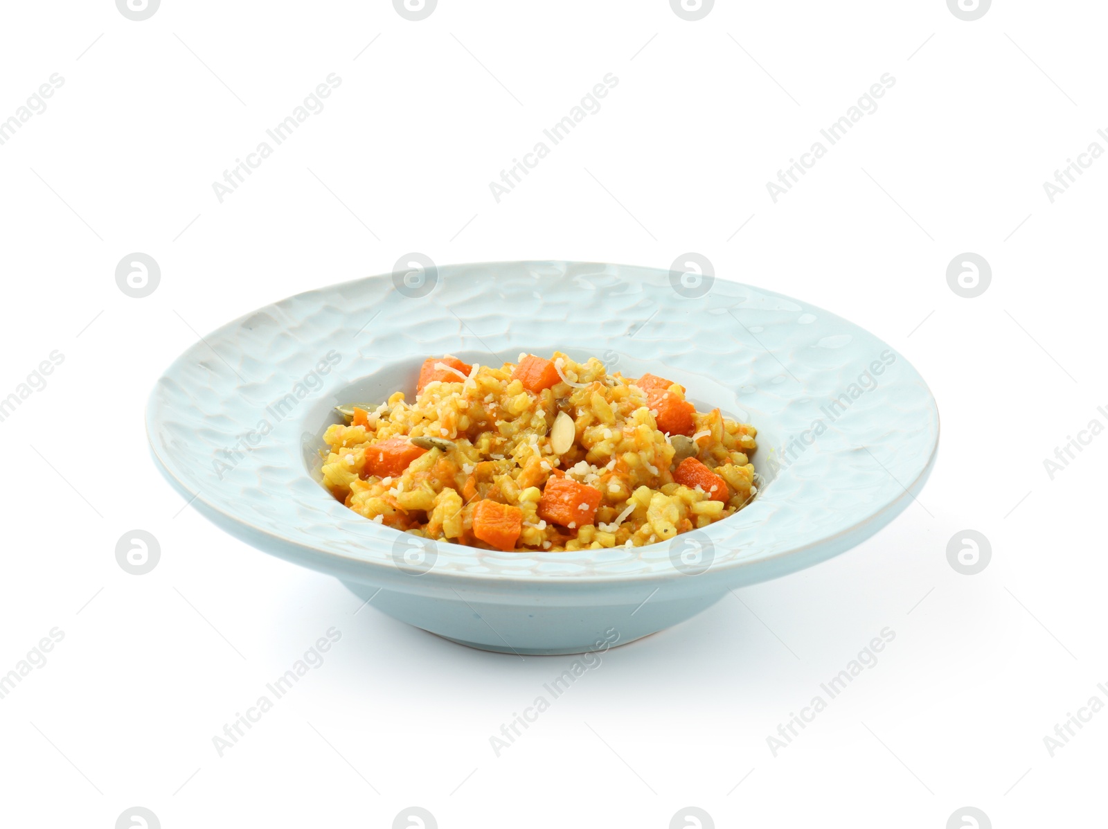 Photo of Delicious pumpkin risotto in bowl isolated on white