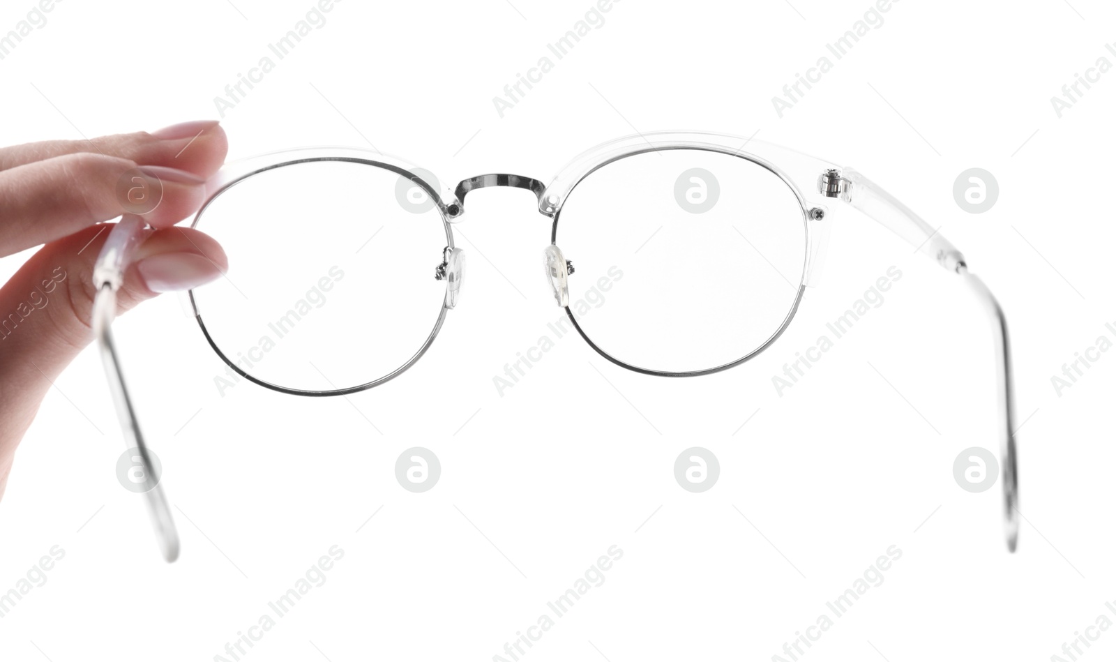 Photo of Woman holding glasses with stylish transparent frame on white background, closeup