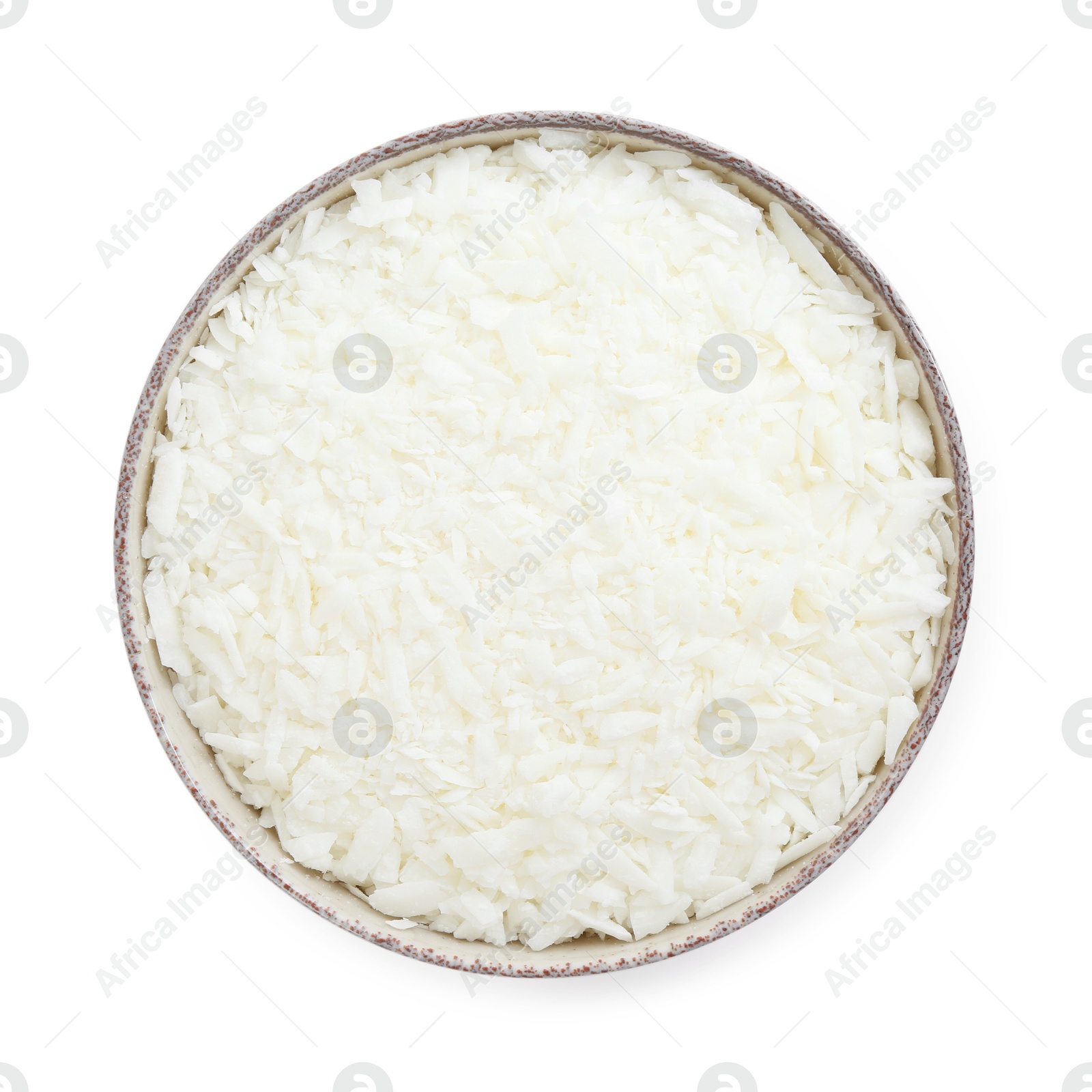 Photo of Soy wax in bowl isolated on white, top view