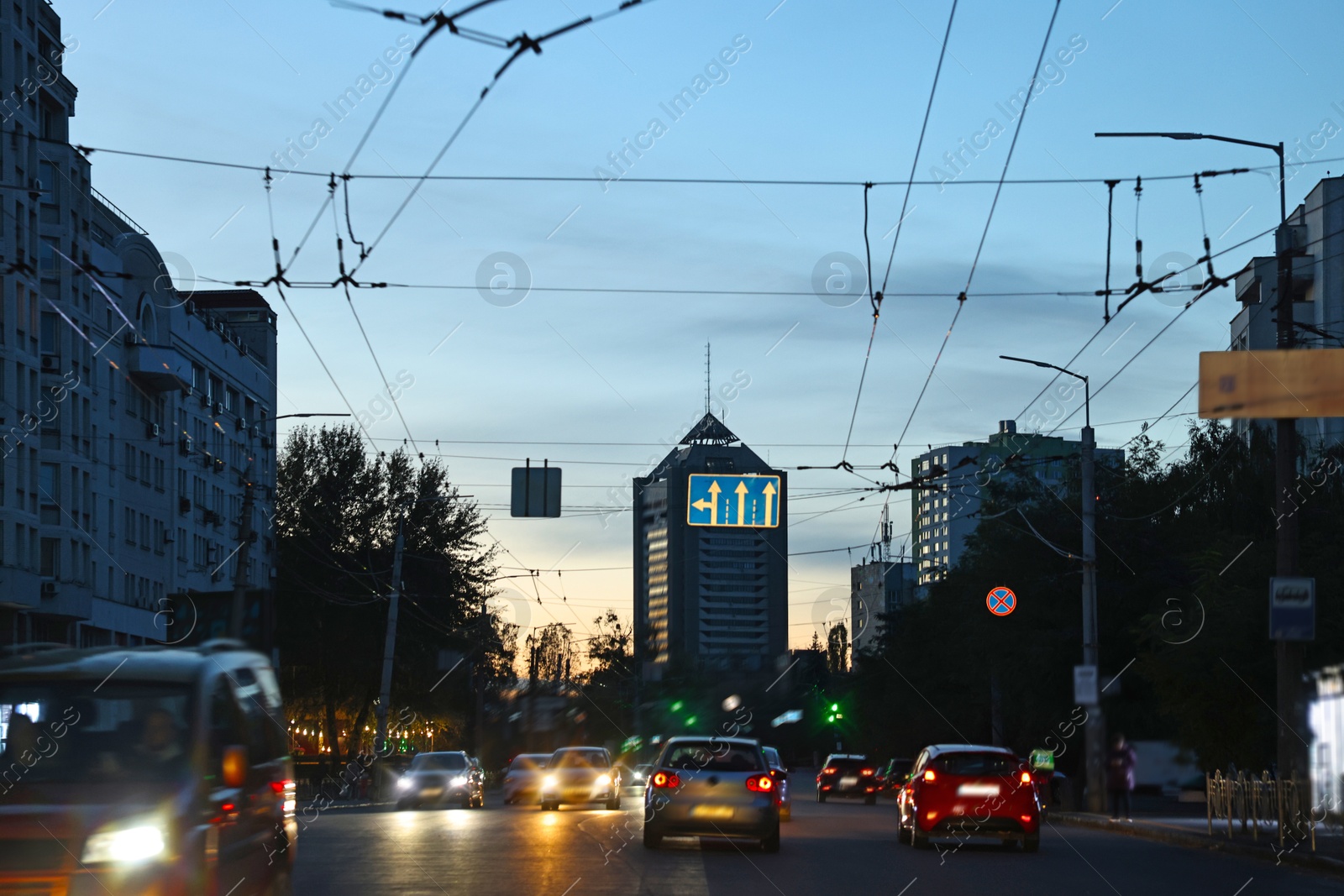 Photo of Cityscape with road traffic and street lights in evening