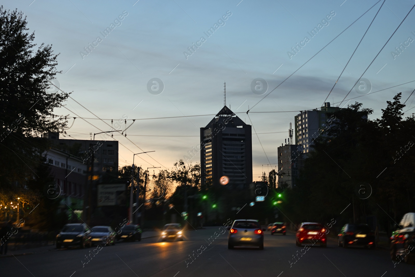 Photo of Cityscape with road traffic and street lights in evening