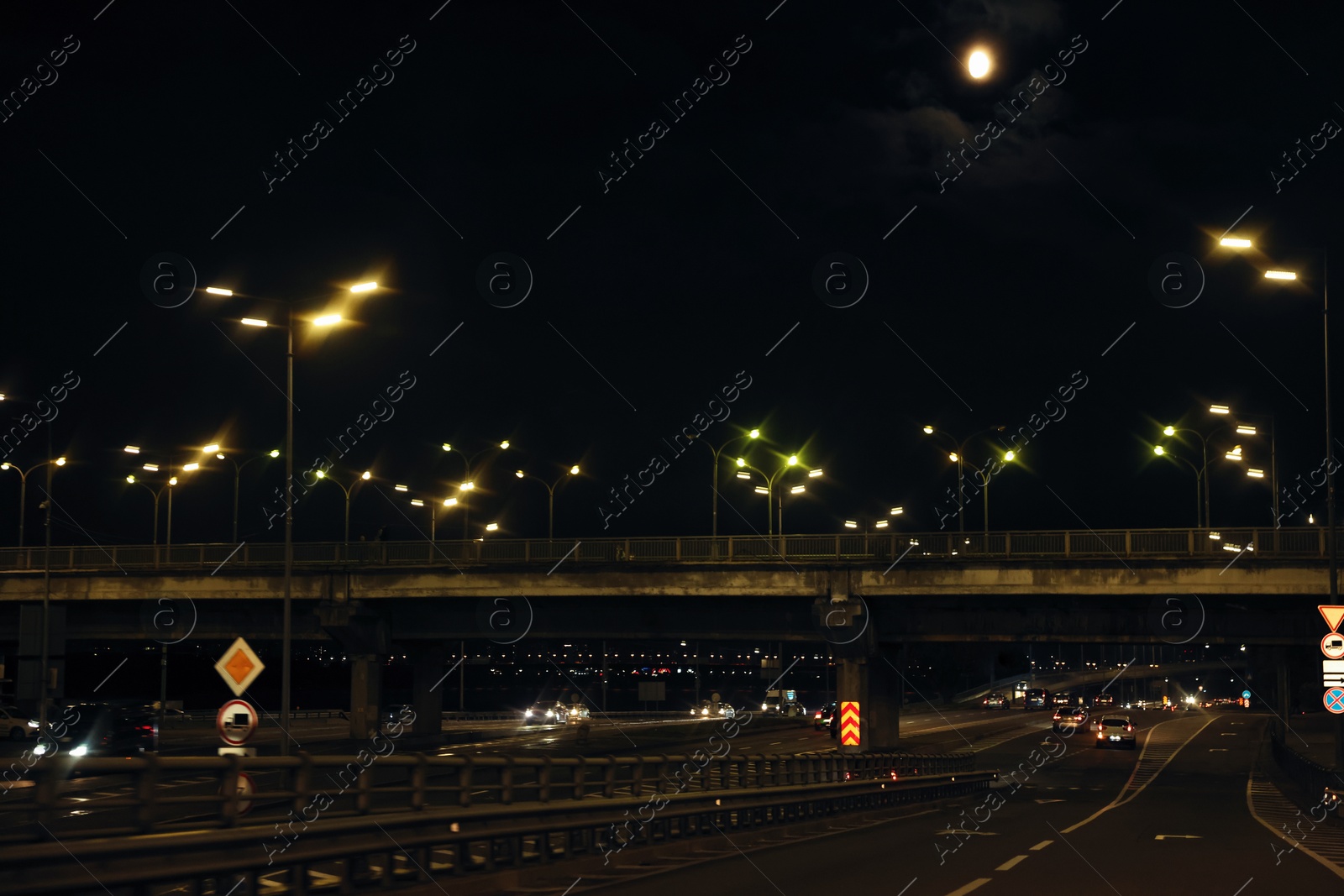 Photo of Cityscape with road traffic and street lights at night