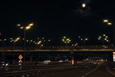 Photo of Cityscape with road traffic and street lights at night