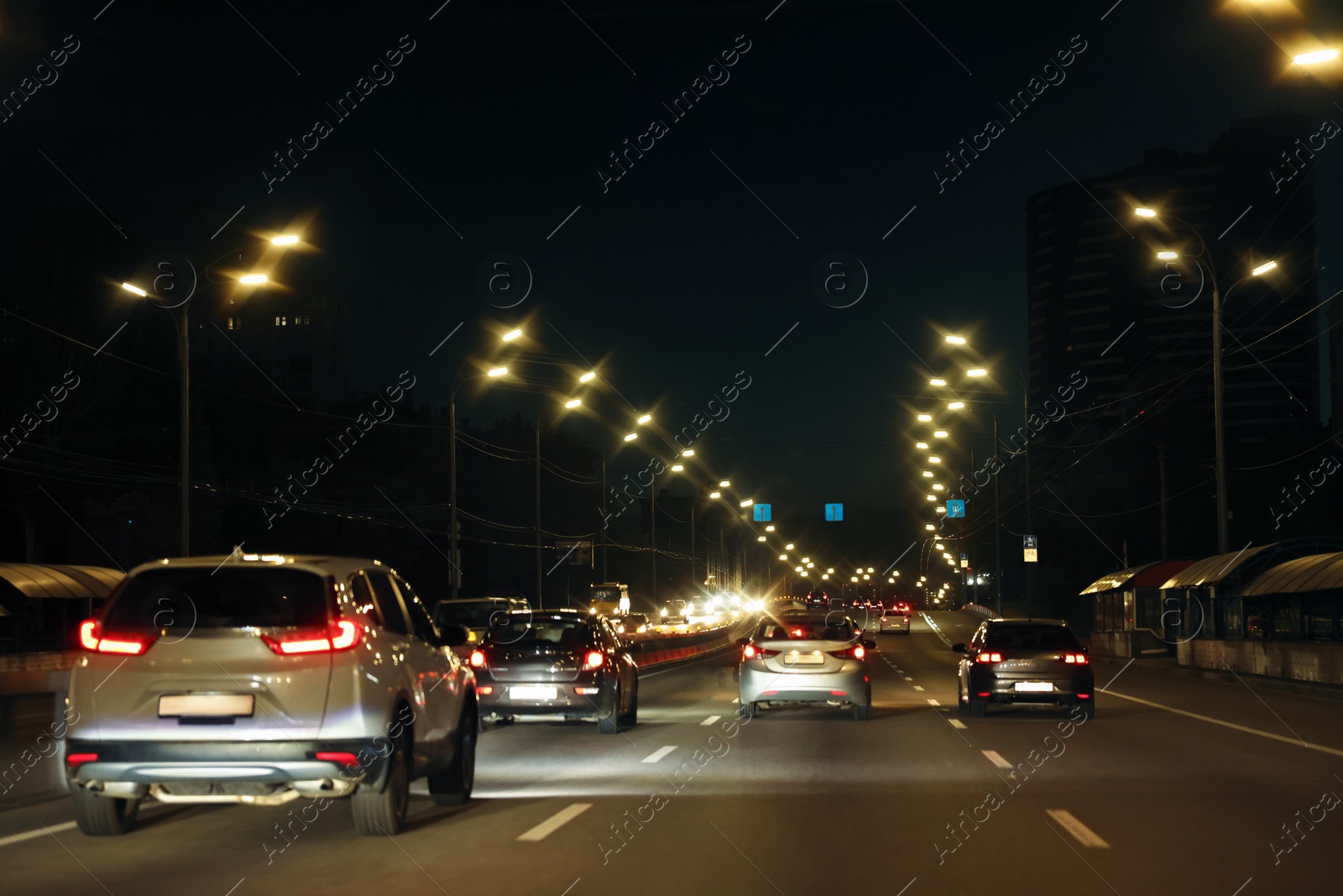 Photo of Cityscape with road traffic and street lights in evening