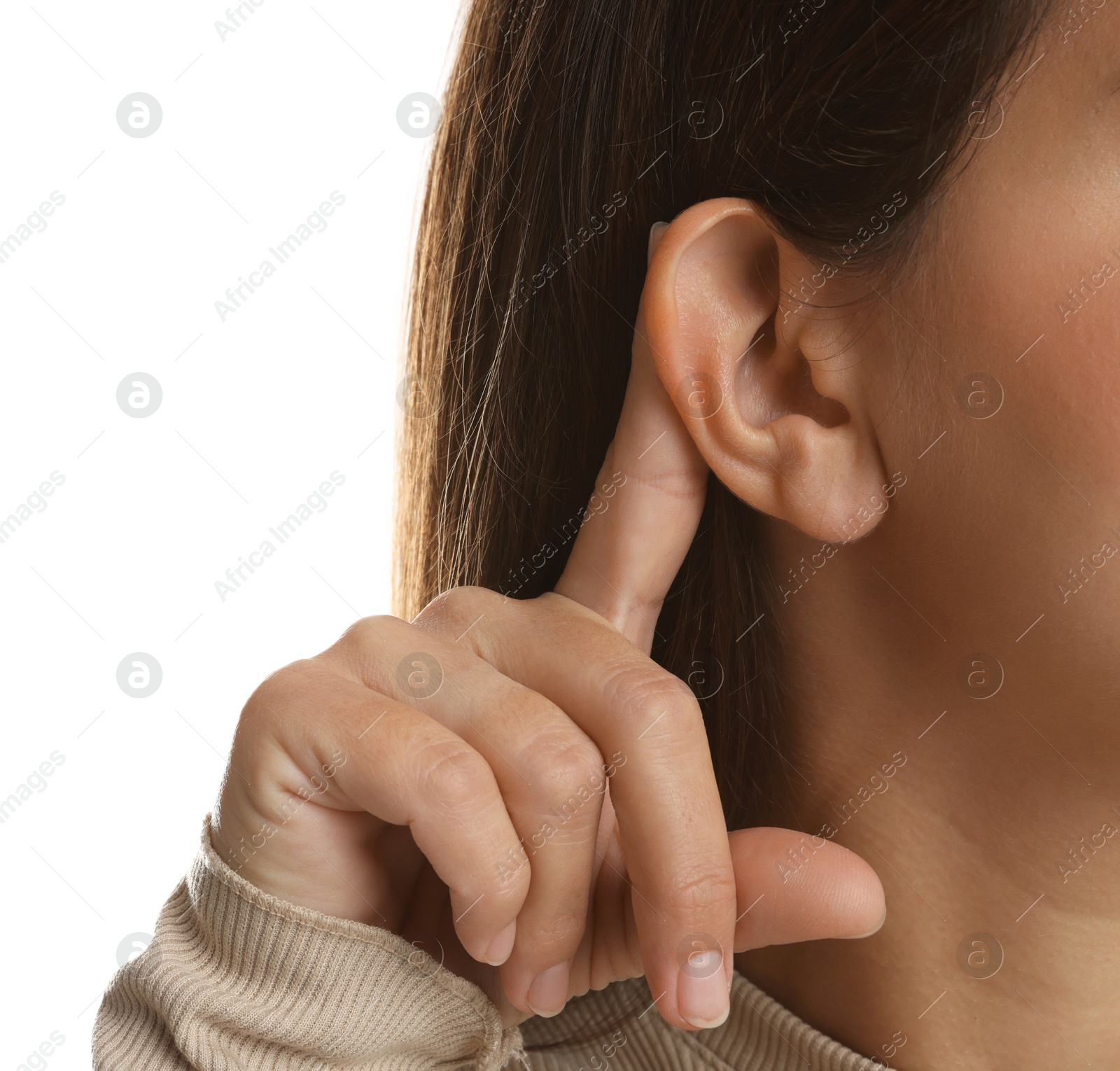 Photo of Woman showing hand to ear gesture on white background, closeup