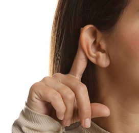 Woman showing hand to ear gesture on white background, closeup