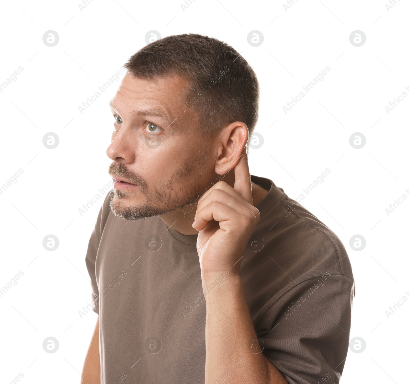 Photo of Man showing hand to ear gesture on white background