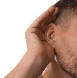 Photo of Man showing hand to ear gesture on white background, closeup